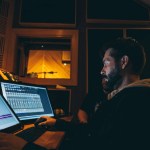 » Home sound engineer using musical software on desktop computers at work